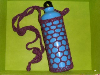 a crocheted water bottle/flask carrier a crocheted water bottle/flask carrier