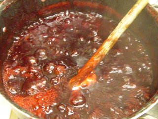 Making plum jam - added sugar Making plum jam - added sugar